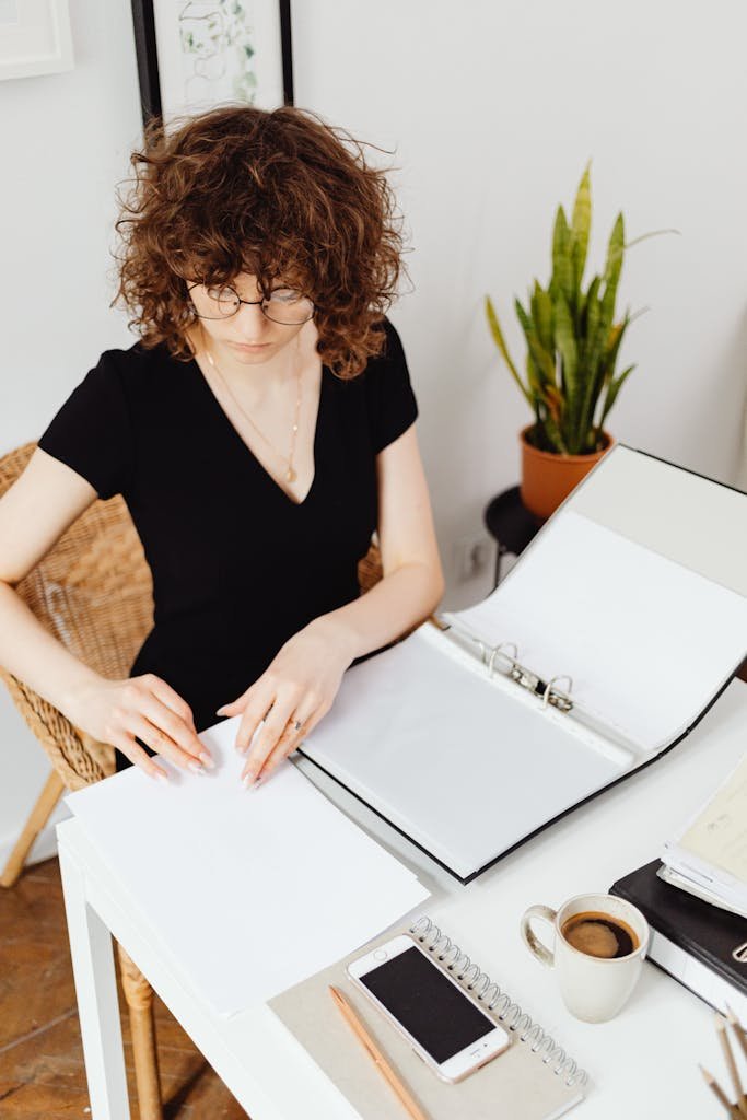 woman organizing binders